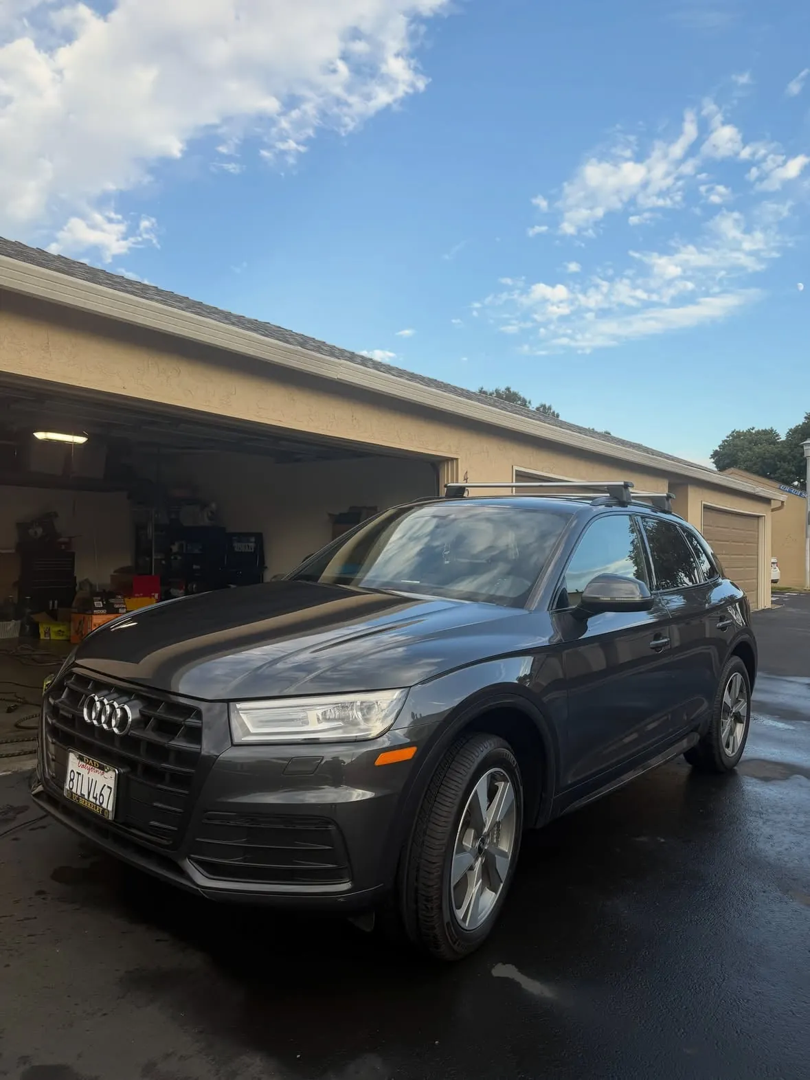 Dark gray Audi Q5 parked in the sun after a detail