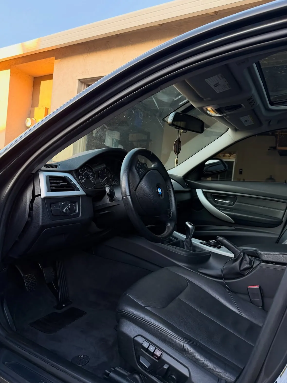 Clean black interior of a BMW after a detail