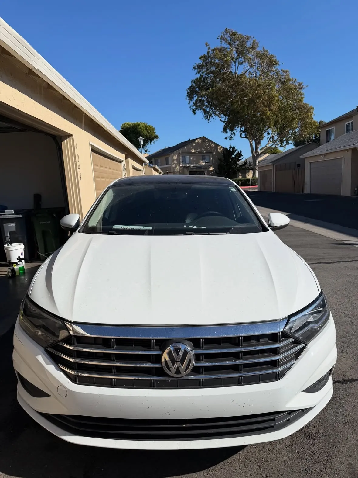 Clean white Volkswagen Jetta after a hand wash