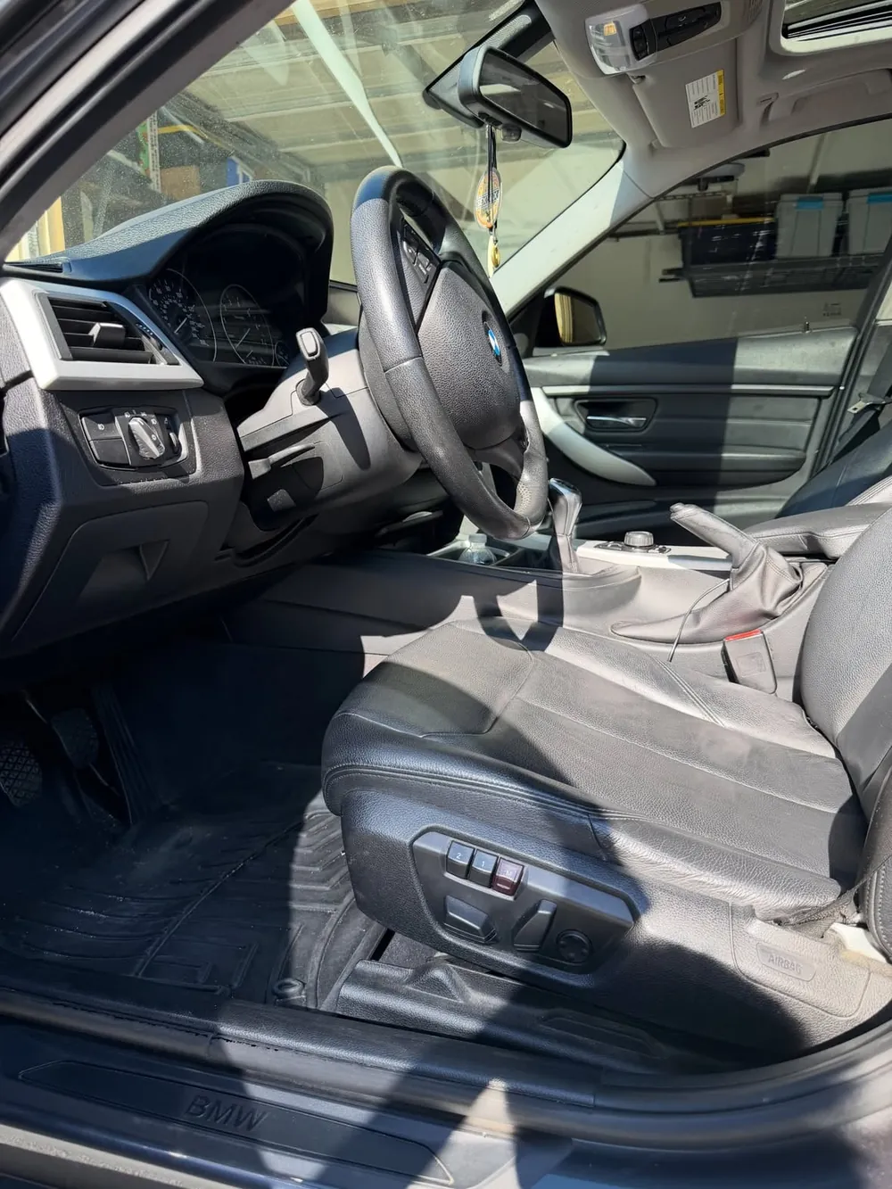 BMW 328i front seats and floor before detailing