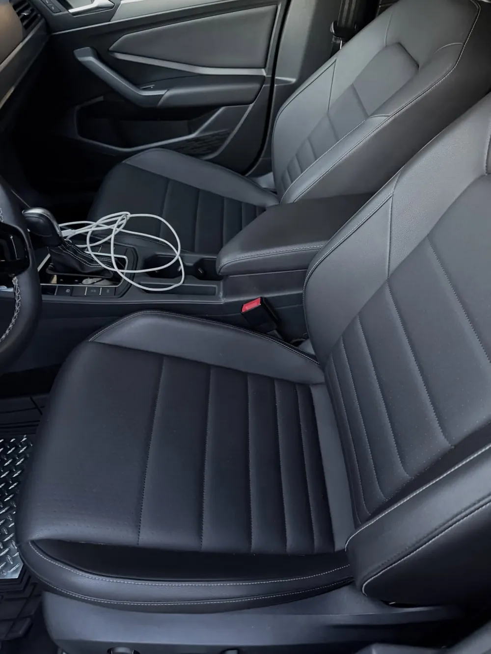The same Volkswagen Jetta leather seat clean after detailing