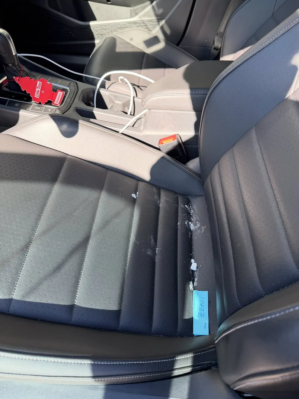 Volkswagen Jetta leather seat with stains before detailing