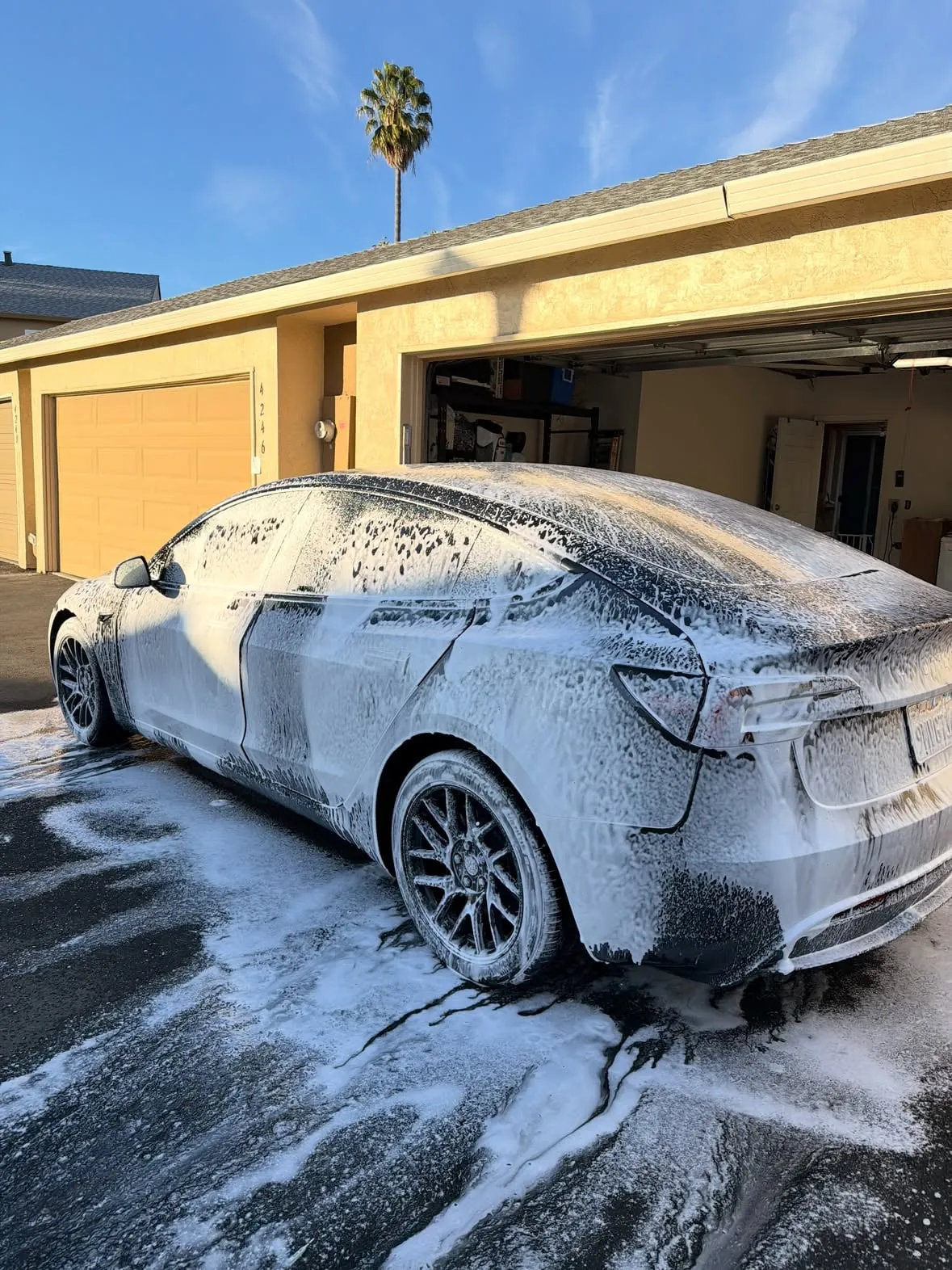 Tesla Model 3 under a blanket of foam